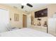 Bedroom featuring a TV, ceiling fan, and dresser with stylish decor at 11913 Butler Woods Cir, Riverview, FL 33579