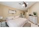 Bedroom featuring comfortable bed, neutral color scheme, and ample natural light at 11913 Butler Woods Cir, Riverview, FL 33579