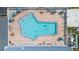 Aerial view of unique neighborhood pool featuring picnic tables and lounging areas at 11913 Butler Woods Cir, Riverview, FL 33579