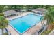 Large community swimming pool with ample deck space for sunbathing and leisure activities at 11913 Butler Woods Cir, Riverview, FL 33579