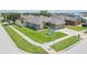 This is a view of the home's exterior, showcasing the green lawn and street view at 11913 Butler Woods Cir, Riverview, FL 33579