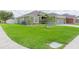 Charming home boasting a lush front lawn, attractive landscaping, and a convenient two-car garage at 11913 Butler Woods Cir, Riverview, FL 33579