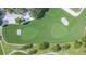 Overhead view of a golf course with sand traps and meticulously maintained greens at 11913 Butler Woods Cir, Riverview, FL 33579