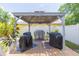 Outdoor grilling station under a gazebo, perfect for entertaining guests at 11913 Butler Woods Cir, Riverview, FL 33579