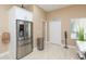 Kitchen view showcasing stainless steel appliances, storage and access to additional spaces at 11913 Butler Woods Cir, Riverview, FL 33579