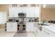 Well-equipped kitchen features stainless steel appliances and ample counter space at 11913 Butler Woods Cir, Riverview, FL 33579
