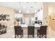 Modern kitchen with island seating and seamless flow to other living spaces at 11913 Butler Woods Cir, Riverview, FL 33579