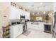 Contemporary kitchen with stainless steel appliances, wine cooler, and ample counter space at 11913 Butler Woods Cir, Riverview, FL 33579