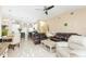 Spacious living room blending seamlessly with the dining area and kitchen in an open-concept design at 11913 Butler Woods Cir, Riverview, FL 33579