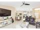 Open-concept living space featuring a living room that flows into the dining area and kitchen at 11913 Butler Woods Cir, Riverview, FL 33579