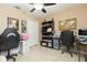Bright home office featuring tile floors, a ceiling fan, and functional workspace for two people at 11913 Butler Woods Cir, Riverview, FL 33579