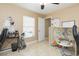 Comfortable office space featuring a window with blinds, tile floors and neutral paint at 11913 Butler Woods Cir, Riverview, FL 33579