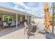 Charming outdoor patio featuring an outdoor dining set, a ceiling fan and multiple seating areas at 11913 Butler Woods Cir, Riverview, FL 33579