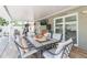 Spacious covered patio with outdoor dining area and a TV for entertainment at 11913 Butler Woods Cir, Riverview, FL 33579