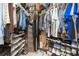 Well-organized walk-in closet with ample storage for clothing, shoes, and accessories at 11913 Butler Woods Cir, Riverview, FL 33579