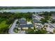 Condo community featuring lush, mature landscaping, buildings, and ample parking at 12261 Sailwinds Dr # 203, Largo, FL 33773