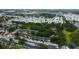 Wide aerial view showcases the property's location within a vibrant neighborhood near green spaces at 12261 Sailwinds Dr # 203, Largo, FL 33773