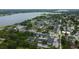 High angle of a large apartment complex with a pool and parking near a lake at 12261 Sailwinds Dr # 203, Largo, FL 33773