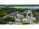 Aerial view of a residential neighborhood featuring lush foliage with waterways in the distance at 12261 Sailwinds Dr # 203, Largo, FL 33773