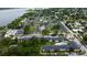 Wide aerial view of a sprawling apartment complex with a pool, manicured lawns, and ample parking at 12261 Sailwinds Dr # 203, Largo, FL 33773