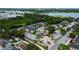 Aerial view featuring community buildings and a large section of surrounding foliage at 12261 Sailwinds Dr # 203, Largo, FL 33773