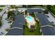 Aerial view of the condo community showing the pool, parking, landscaping, and multiple buildings at 12261 Sailwinds Dr # 203, Largo, FL 33773