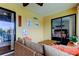 Inviting screened balcony with comfortable seating, views, and sliding glass doors leading to indoor living spaces at 12261 Sailwinds Dr # 203, Largo, FL 33773