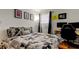 This bedroom has carpet and a window at 12261 Sailwinds Dr # 203, Largo, FL 33773
