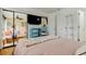 Bedroom with glass enclosed walk-in closet and views into the living room and kitchen at 12261 Sailwinds Dr # 203, Largo, FL 33773