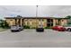 Multi-Gathering condo building with neutral paint, parking, and stairs leading to the second-floor units at 12261 Sailwinds Dr # 203, Largo, FL 33773
