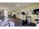 Well-equipped community gym featuring various exercise machines, weights, and fitness equipment at 12261 Sailwinds Dr # 203, Largo, FL 33773