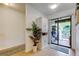 Hallway with sliding glass door leading to the back porch, allowing natural light to brighten the space at 12261 Sailwinds Dr # 203, Largo, FL 33773