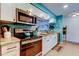 Updated kitchen with stainless steel appliances, white cabinets and granite countertops at 12261 Sailwinds Dr # 203, Largo, FL 33773