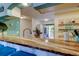 Kitchen breakfast bar with granite countertops and seating at 12261 Sailwinds Dr # 203, Largo, FL 33773