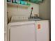 This laundry room has a washer and dryer at 12261 Sailwinds Dr # 203, Largo, FL 33773