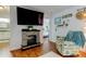 Bright living room with fireplace and decorative coastal theme at 12261 Sailwinds Dr # 203, Largo, FL 33773