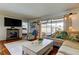 Living room with fireplace and sliding glass door to the balcony at 12261 Sailwinds Dr # 203, Largo, FL 33773