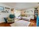 Comfortable living room with sliding glass door to the balcony at 12261 Sailwinds Dr # 203, Largo, FL 33773