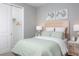 Cozy bedroom with neutral tones, closet, a full sized bed, and art at 12586 Somatic Ct, Venice, FL 34293
