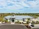 Modern community home with a metal roof, a sleek entrance, and well-maintained landscaping at 12586 Somatic Ct, Venice, FL 34293