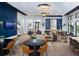 Modern lounge area with comfortable seating, stylish decor, and ample natural light at 12586 Somatic Ct, Venice, FL 34293