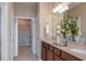 Bathroom features a dual sink vanity, granite countertops, and walk-in closet at 13740 Rocky Pine Pl, Spring Hill, FL 34610