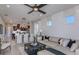 Open-concept living space featuring a ceiling fan and seamless flow into dining and kitchen at 13740 Rocky Pine Pl, Spring Hill, FL 34610