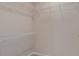Spacious walk-in closet with multiple shelving levels for storage at 13740 Rocky Pine Pl, Spring Hill, FL 34610
