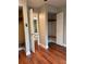 Cozy bedroom with hardwood floors, closet and a view to an adjacent bathroom at 1400 Pine Glen Ln # D2, Tarpon Springs, FL 34688
