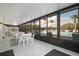 Indoor-Outdoor pool area with tables, chairs, and lounging area at 1400 Pine Glen Ln # D2, Tarpon Springs, FL 34688