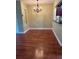 Cozy dining room featuring beautiful flooring and an elegant chandelier at 1400 Pine Glen Ln # D2, Tarpon Springs, FL 34688