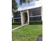 Beautiful condo with a private balcony, manicured lawn, and convenient access to community amenities at 1400 Pine Glen Ln # D2, Tarpon Springs, FL 34688