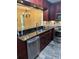 Modern kitchen with stainless appliances, granite countertops and an open design at 1400 Pine Glen Ln # D2, Tarpon Springs, FL 34688