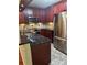 Updated kitchen featuring stainless steel appliances, granite countertops, and plenty of cabinet space at 1400 Pine Glen Ln # D2, Tarpon Springs, FL 34688